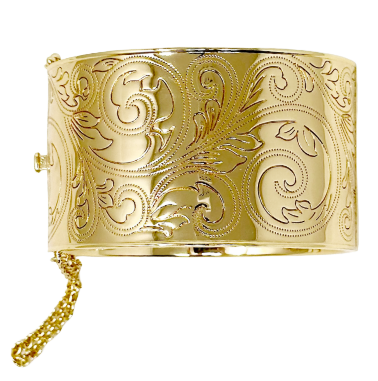A wide gold cuff bracelet with an engraved scrollwork pattern, shown against a plain white background.