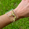 Dog charm on a clear acrylic cuff bracelet