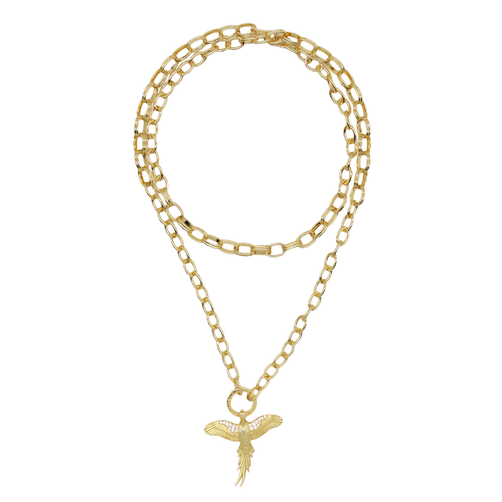 A gold-toned double-strand chain necklace featuring a parrot pendant adorned with small clear crystals, displayed on a clean white background.